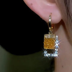 Close-up detail of the sparkling zircons and plating on the Square Crystal Earrings