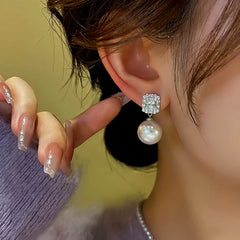 Close-up detail of the sparkling zircons and plating on the Square Zircon Earrings