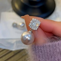 Angled view of the 14K Gold-Plated Square Zircon Bead Earrings
