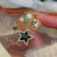 Angled view of the 14K Gold-Plated Star Tassel Bead Earrings