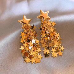 Angled view of the 14K Gold-Plated Star Tassel Earrings