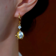 Close-up detail of the sparkling zircons and plating on the Stone Pearl Earrings