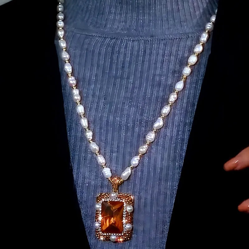 Close-up of the pendant and clasp on the Pearl Sweater Necklace