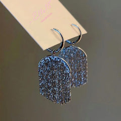 Close-up detail of the sparkling zircons and plating on the Tassel Pendant Earrings