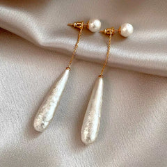 Angled view of the 14K Gold-Plated Textured Water Drop Pearl Earrings
