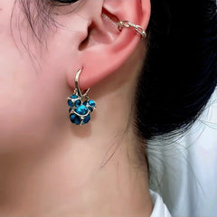 Close-up detail of the sparkling zircons and plating on the Cat's Eye Earrings