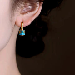 Close-up detail of the sparkling zircons and plating on the U-Shaped Earrings
