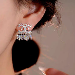 Close-up detail of the sparkling zircons and plating on the Versatile Commuting Earrings