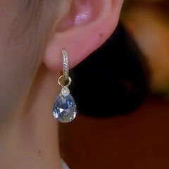 Model showcasing the dangle and style of the 14K Gold-Plated Water Drop Earrings