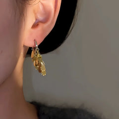 Close-up detail of the sparkling zircons and plating on the Gold Teardrop Earrings