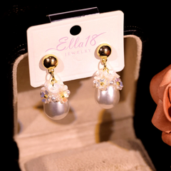 Angled view of the 14K Gold-Plated Water Drop Flower Pearl Earrings