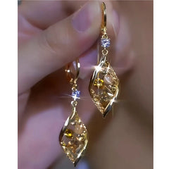 Close-up detail of the sparkling zircons and plating on the Cat's Eye Earrings