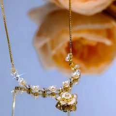 Close-up of the pendant and clasp on the White Camellia Necklace