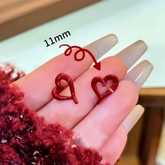 Close-up detail of the sparkling zircons and plating on the Red Heart Studs