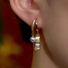 Close-up detail of the sparkling zircons and plating on the Bamboo Pearl Earrings