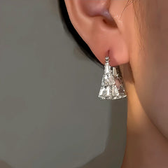 Model showcasing the dangle and style of the 14K Gold-Plated Zircon Bead Handnbag Earrings