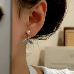 Close-up detail of the sparkling zircons and plating on the Fishtail Bead Earrings