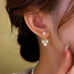 Close-up detail of the sparkling zircons and plating on the Bow Jacket Earrings