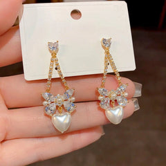 Close-up detail of the sparkling zircons and plating on the Pearl Heart Earrings