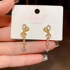 Close-up detail of the sparkling zircons and plating on the Gold Tassel Earrings