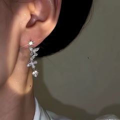 Close-up detail of the sparkling zircons and plating on the Silver Butterfly Earrings