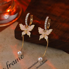 Angled view of the 14K Gold-Plated Zircon Butterfly Pearl Earrings
