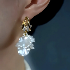 Close-up detail of the sparkling zircons and plating on the Double Butterfly Earrings