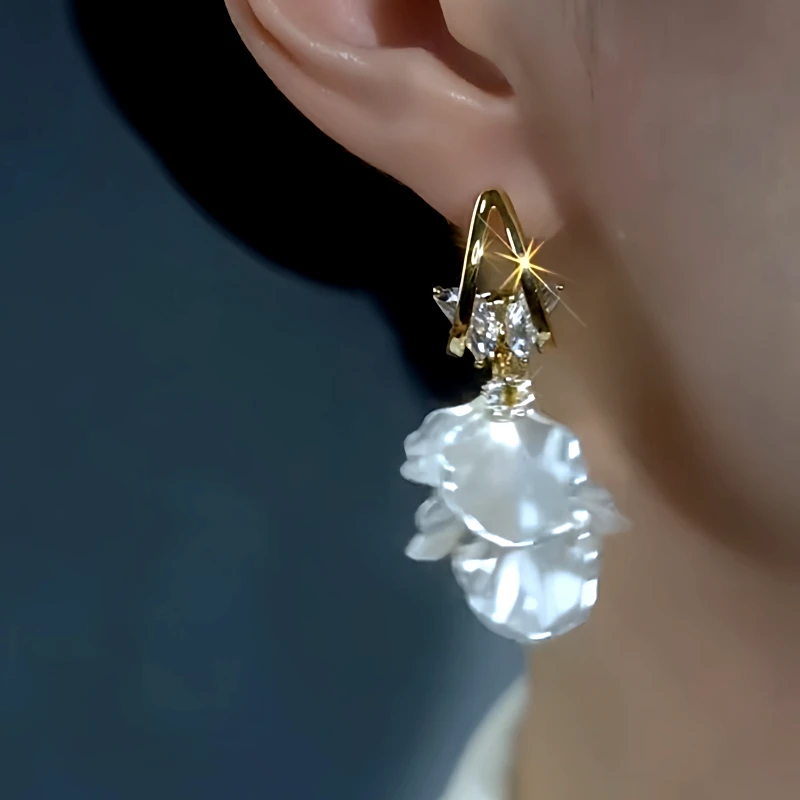 Model showcasing the dangle and style of the 14K Gold-Plated Zircon Butterfly Tassel Earrings