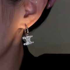 Close-up detail of the sparkling zircons and plating on the Silver Hoop Earrings