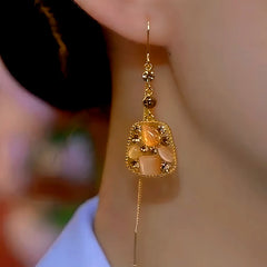 Close-up detail of the sparkling zircons and plating on the Cat's Eye Threader Earrings