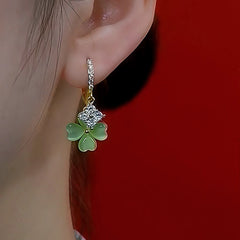 Model showcasing the dangle and style of the 14K Gold-Plated Zircon Cat's Eye Four Leaf Earrings