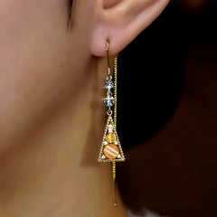 Model showcasing the dangle and style of the 14K Gold-Plated Zircon Cat's Eye Geometric Triangle Threader Earrings