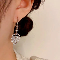 Angled view of the 14K Gold-Plated Zircon Cat's Eye Leaf Ear Hook Earrings
