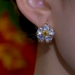 Close-up detail of the sparkling zircons and plating on the Cat's Eye Flower Earrings