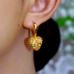 Model showcasing the dangle and style of the 14K Gold-Plated Zircon Cat's Eye Stone Heart Earrings