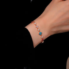 Close-up of the clasp and charm details on the Silver Flower Bracelet