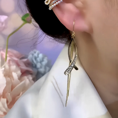Model showcasing the dangle and style of the 14K Gold-Plated Zircon Cross Ear Hook Earrings