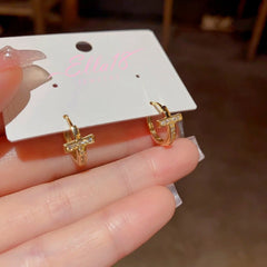 Angled view of the 14K Gold-Plated Zircon Cross Hoop Earrings
