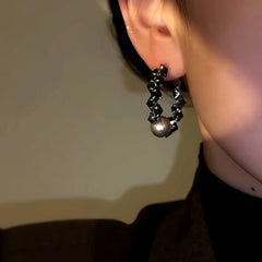 Close-up detail of the sparkling zircons and plating on the Black Bead Hoops