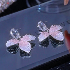 Angled view of the 14K Gold-Plated Zircon Crystal Flower Earrings