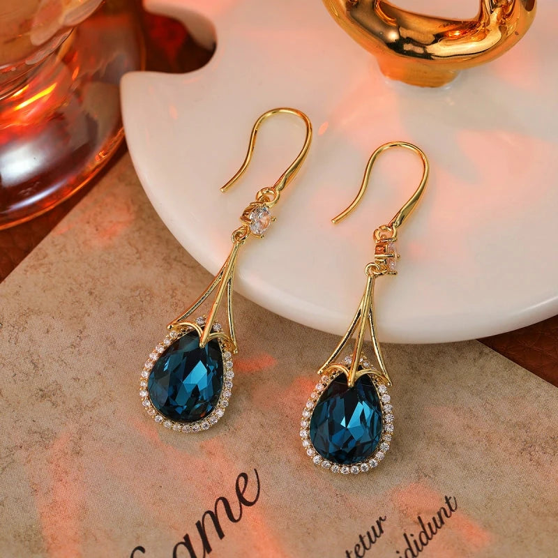 Angled view of the 14K Gold-Plated Zircon Crystal Tassel Earrings