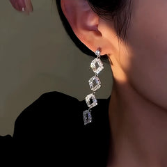 Close-up detail of the sparkling zircons and plating on the Crystal Tassel Earrings