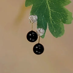 Angled view of the 14K Gold-Plated Zircon Diamond Black Pearl Earrings
