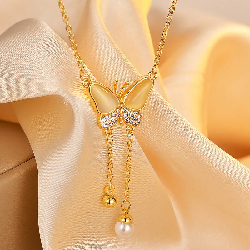 14K Gold-Plated Zircon Diamond Cat's Eye Stone Butterfly Tassel Necklace worn to showcase its length and pendant detail
