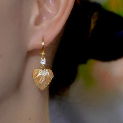 Close-up detail of the sparkling zircons and plating on the Cat's Eye Heart Earrings