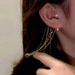 Model showcasing the dangle and style of the 14K Gold-Plated Zircon Diamond Chain Tassel Ear Cuffs ( 1 Pair )