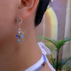 Close-up detail of the sparkling zircons and plating on the Gold Dangle Earrings