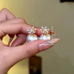 Close-up detail of the sparkling zircons and plating on the Flower Bead Earrings