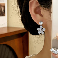 Close-up detail of the sparkling zircons and plating on the Silver Flower Tassel Earrings
