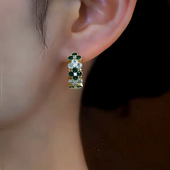 Close-up detail of the sparkling zircons and plating on the Green Clover Hoops